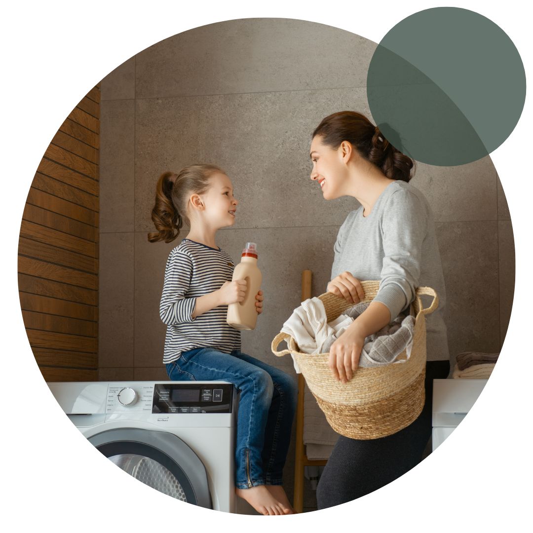 Mother and daughter doing laundry together